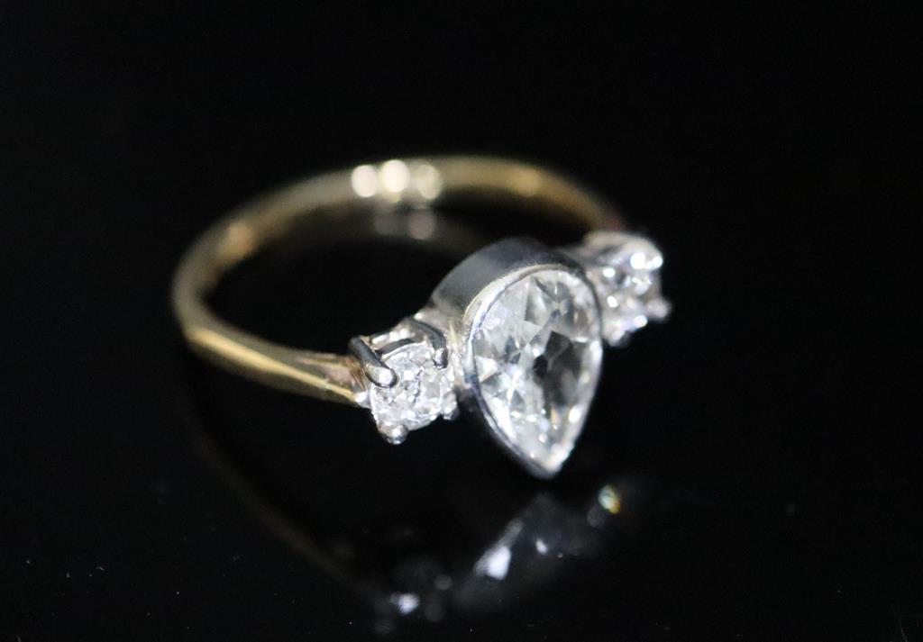A gold and three stone diamond ring,